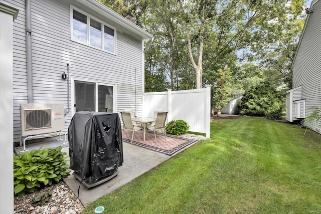 view of yard with ac unit and a patio