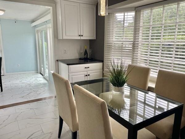 2 Spinning Brook Rd, South Yarmouth, MA 02664 - dining room featuring light marble finish flooring and baseboards