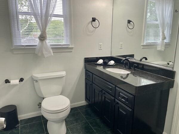 2 Spinning Brook Rd, South Yarmouth, MA 02664 - half bathroom with vanity and tile patterned flooring