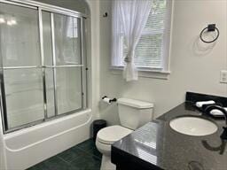 2 Spinning Brook Rd, South Yarmouth, MA 02664 - bathroom with vanity, shower / bath combination with glass door, and tile patterned floors