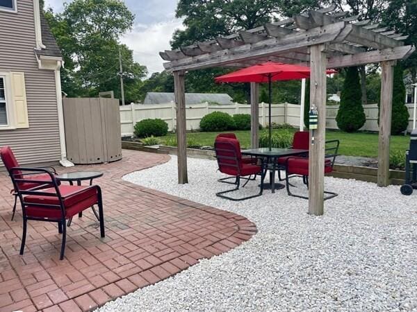 2 Spinning Brook Rd, South Yarmouth, MA 02664 - view of patio with a pergola and outdoor dining space