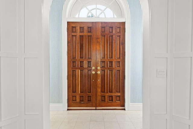 foyer featuring light tile patterned flooring