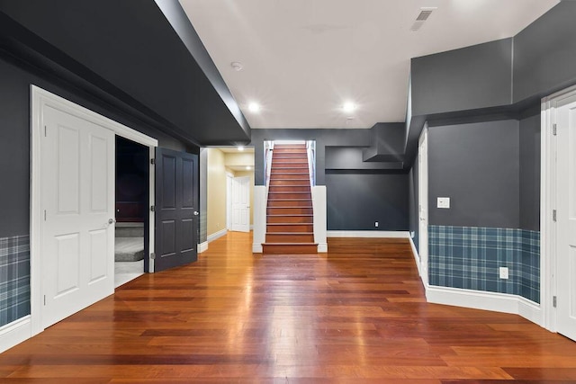 unfurnished living room featuring wood-type flooring