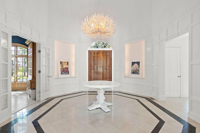 entryway featuring a chandelier