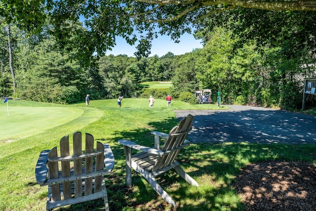 12 Kettle Ln, Mashpee, MA 02649 - view of community featuring a yard, a putting area, and golf course view
