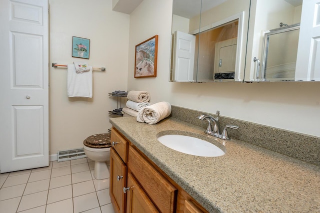 12 Kettle Ln, Mashpee, MA 02649 - bathroom featuring toilet, vanity, tile patterned flooring, and a shower with shower door