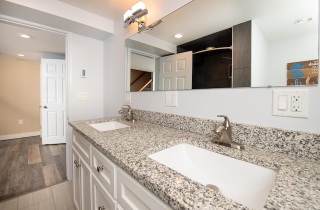 56 S Yarmouth Rd, Dennis, MA 02638 - full bathroom with double vanity, recessed lighting, and baseboards