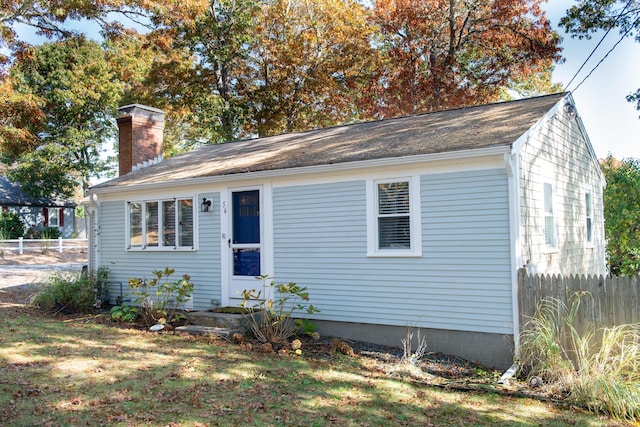56 S Yarmouth Rd, Dennis, MA 02638 - view of front of property with a chimney and roof with shingles