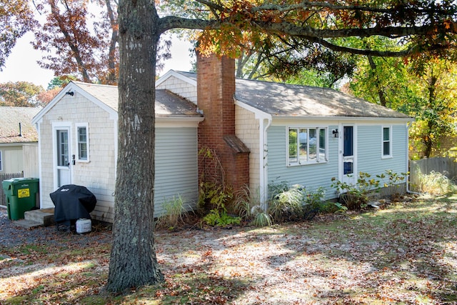 56 S Yarmouth Rd, Dennis, MA 02638 - view of front of property featuring a chimney and a shingled roof
