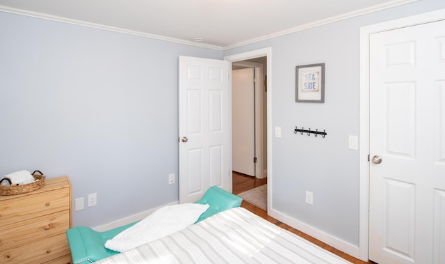 56 S Yarmouth Rd, Dennis, MA 02638 - bedroom featuring wood finished floors, ornamental molding, and baseboards