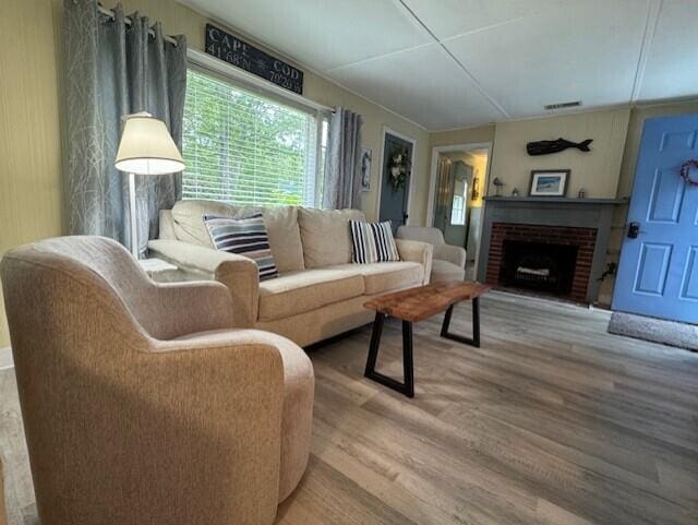 9 Bayberry Ln, South Dennis, MA 02660 - living area with wood finished floors and a fireplace