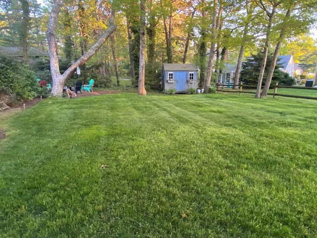 9 Bayberry Ln, South Dennis, MA 02660 - view of green lawn featuring a storage shed