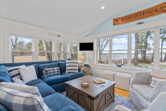 living room with vaulted ceiling and light hardwood / wood-style floors