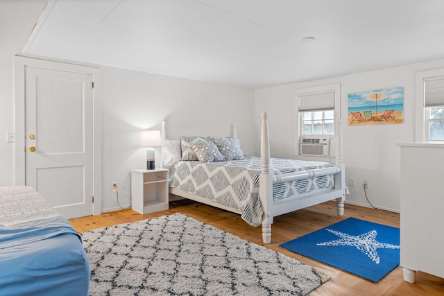 bedroom featuring cooling unit and wood-type flooring