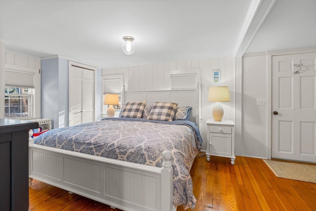 bedroom featuring a closet and hardwood / wood-style flooring