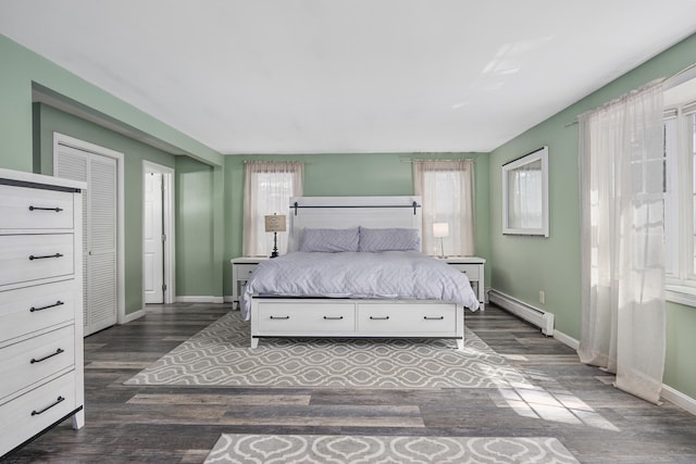 65 Hadrada Ln, Centerville, MA 02632 - bedroom featuring baseboard heating and dark wood-style floors