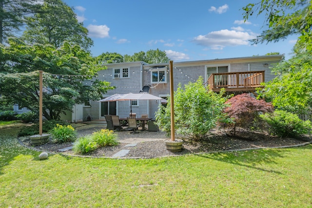 65 Hadrada Ln, Centerville, MA 02632 - back of house featuring a yard, a deck, and a patio
