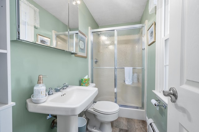 65 Hadrada Ln, Centerville, MA 02632 - bathroom featuring a stall shower, wood finished floors, and a textured ceiling