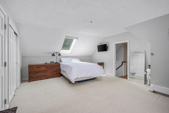 65 Hadrada Ln, Centerville, MA 02632 - bedroom with carpet, a skylight, vaulted ceiling, and a closet