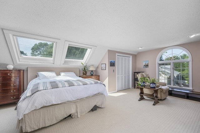 65 Hadrada Ln, Centerville, MA 02632 - bedroom with carpet floors, a textured ceiling, and a skylight