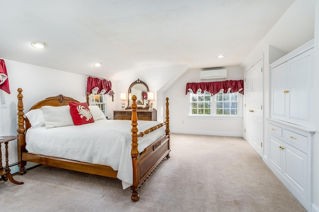 carpeted bedroom featuring a wall mounted air conditioner and lofted ceiling