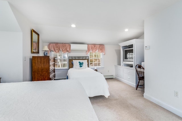 carpeted bedroom with baseboard heating and a wall unit AC