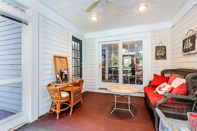 sunroom / solarium with ceiling fan