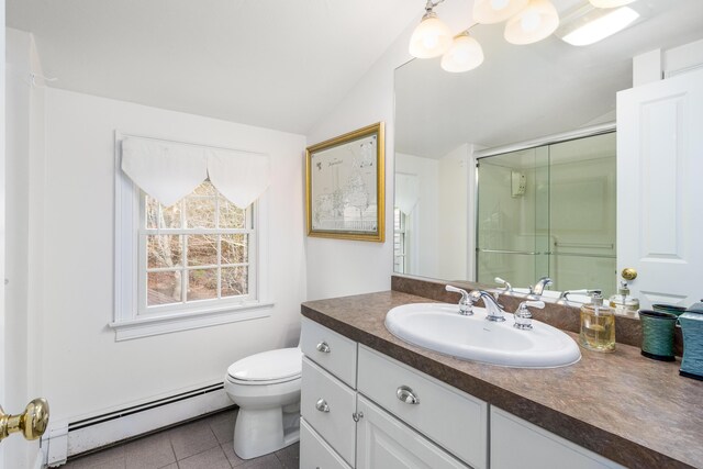 bathroom with lofted ceiling, tile patterned floors, a baseboard heating unit, vanity, and toilet