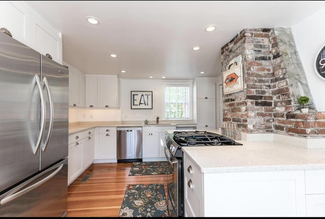 54 Commercial St Unit 3, 4, 5, 6, Provincetown, MA 02657 - kitchen featuring recessed lighting, white cabinetry, a sink, light wood-style flooring, and appliances with stainless steel finishes