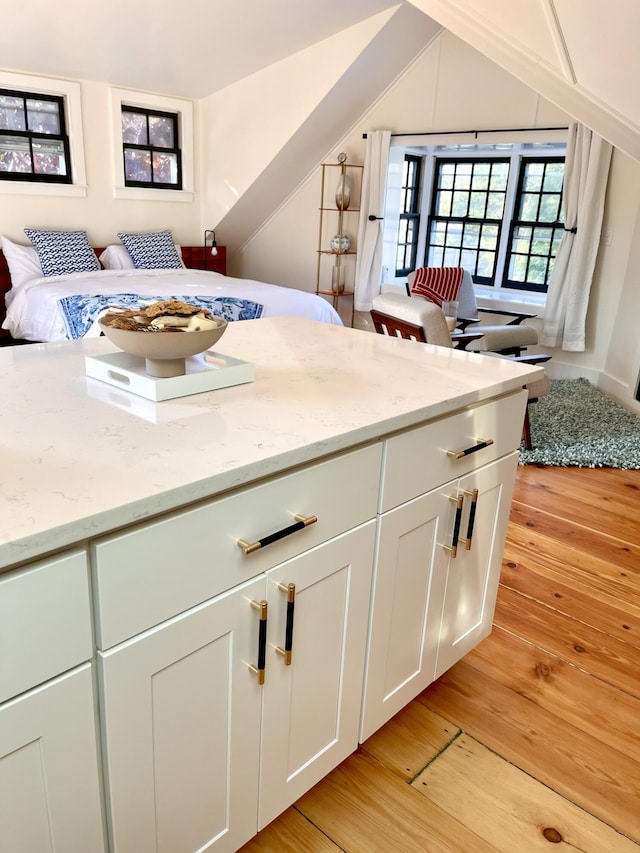 54 Commercial St Unit 3, 4, 5, 6, Provincetown, MA 02657 - interior space featuring white cabinets, light stone countertops, and light wood-style floors