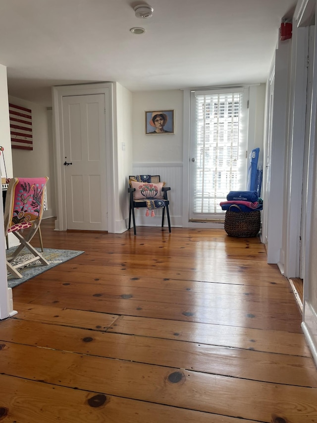 54 Commercial St Unit 3, 4, 5, 6, Provincetown, MA 02657 - sitting room with a wainscoted wall and wood-type flooring