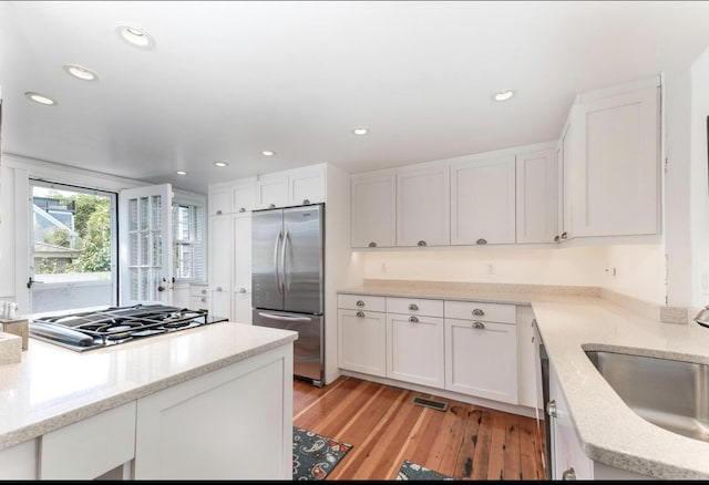 54 Commercial St Unit 3, 4, 5, 6, Provincetown, MA 02657 - kitchen with recessed lighting, stainless steel fridge, a sink, and gas stovetop