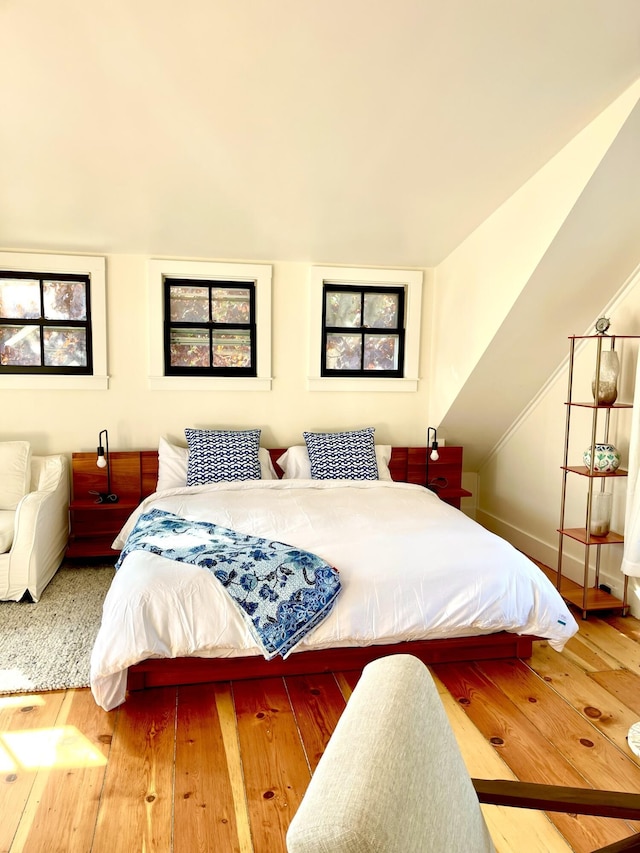 54 Commercial St Unit 3, 4, 5, 6, Provincetown, MA 02657 - bedroom with wood-type flooring and lofted ceiling