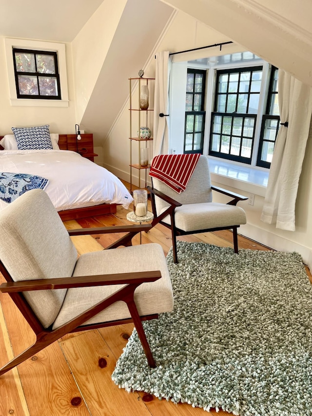 54 Commercial St Unit 3, 4, 5, 6, Provincetown, MA 02657 - bedroom with baseboards, vaulted ceiling, and wood finished floors