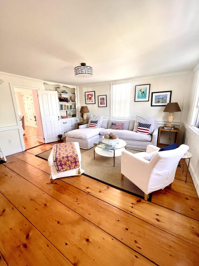 54 Commercial St Unit 3, 4, 5, 6, Provincetown, MA 02657 - living area with crown molding and hardwood / wood-style floors