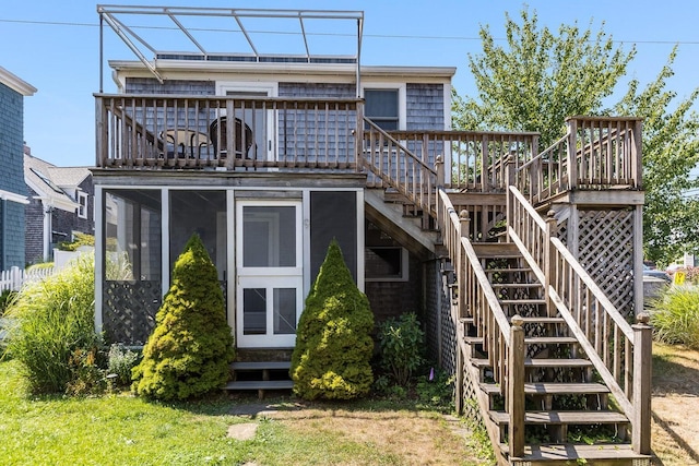 49 Bradford St Unit 9, Provincetown, MA 02657 - rear view of property with stairs, a wooden deck, and a sunroom