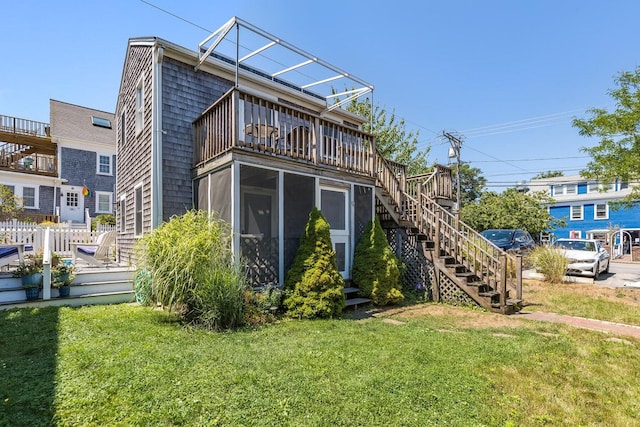 49 Bradford St Unit 9, Provincetown, MA 02657 - rear view of property with stairs, a sunroom, and a balcony