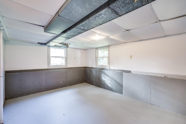 basement featuring a paneled ceiling