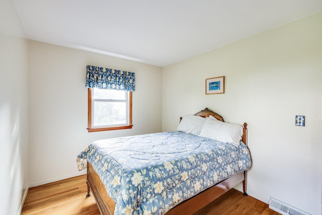 bedroom featuring wood-type flooring