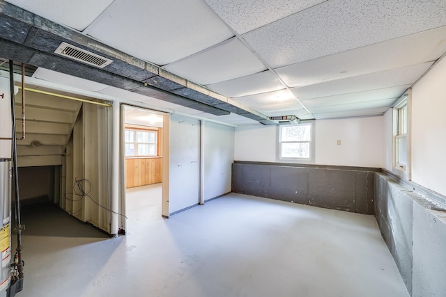 basement featuring a drop ceiling