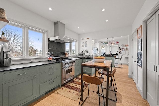 2 Seaview Rd, Orleans, MA 02653 - kitchen featuring light wood-style floors, ventilation hood, recessed lighting, and high end stove