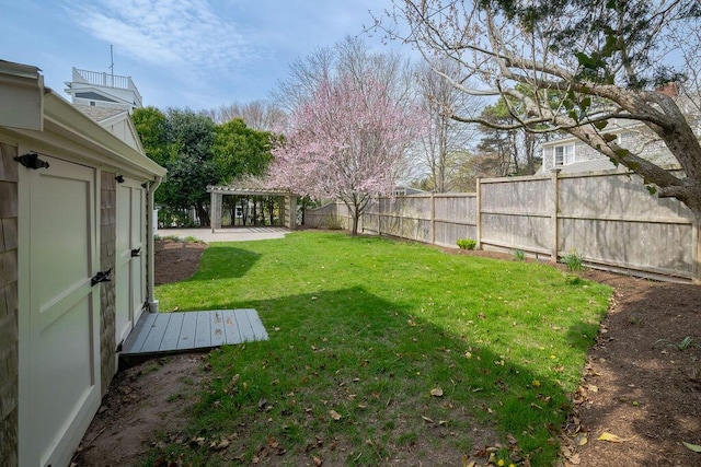 view of yard with a pergola and fence