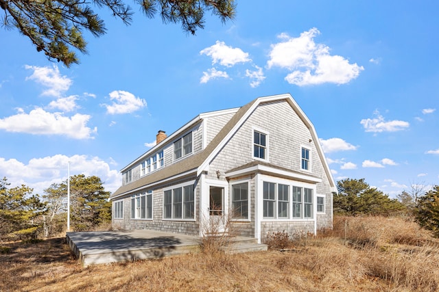 rear view of property featuring a patio