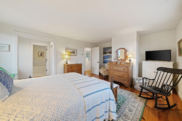 bedroom with hardwood / wood-style flooring