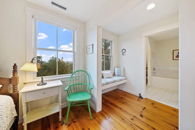 sitting room featuring light hardwood / wood-style flooring