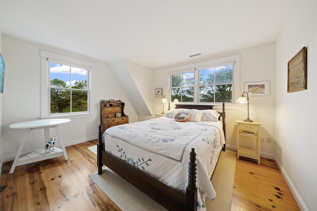 bedroom with light hardwood / wood-style floors