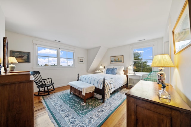 bedroom with light hardwood / wood-style floors