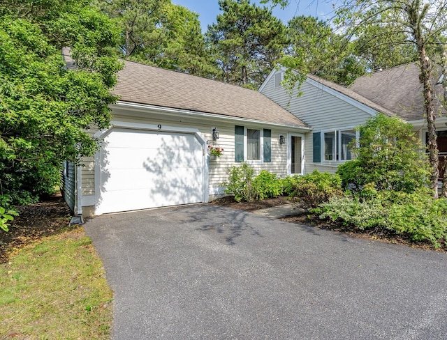 9 Pacific Ave, Mashpee, MA 02649 - ranch-style house featuring asphalt driveway, a garage, and roof with shingles