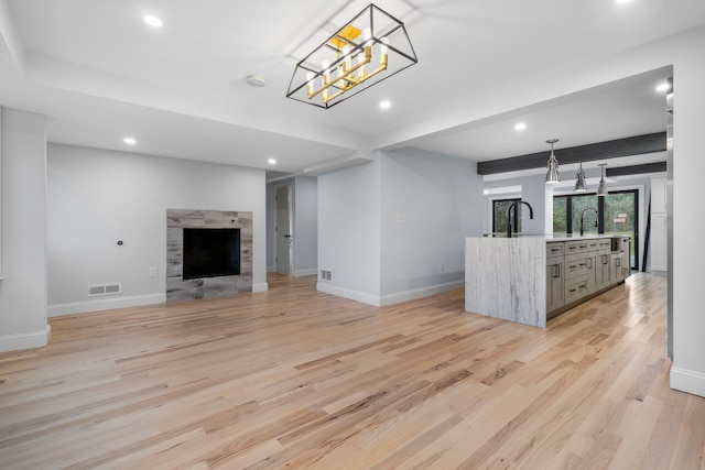38 Mill St, Dennis Port, MA 02639 - unfurnished living room with recessed lighting, light wood-type flooring, visible vents, and baseboards