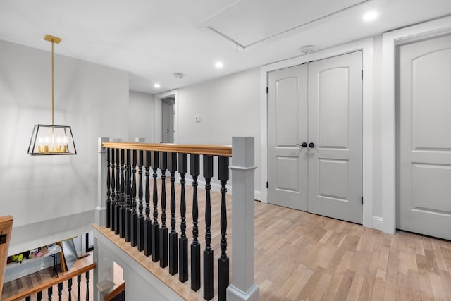 38 Mill St, Dennis Port, MA 02639 - stairs featuring attic access, baseboards, wood finished floors, and recessed lighting
